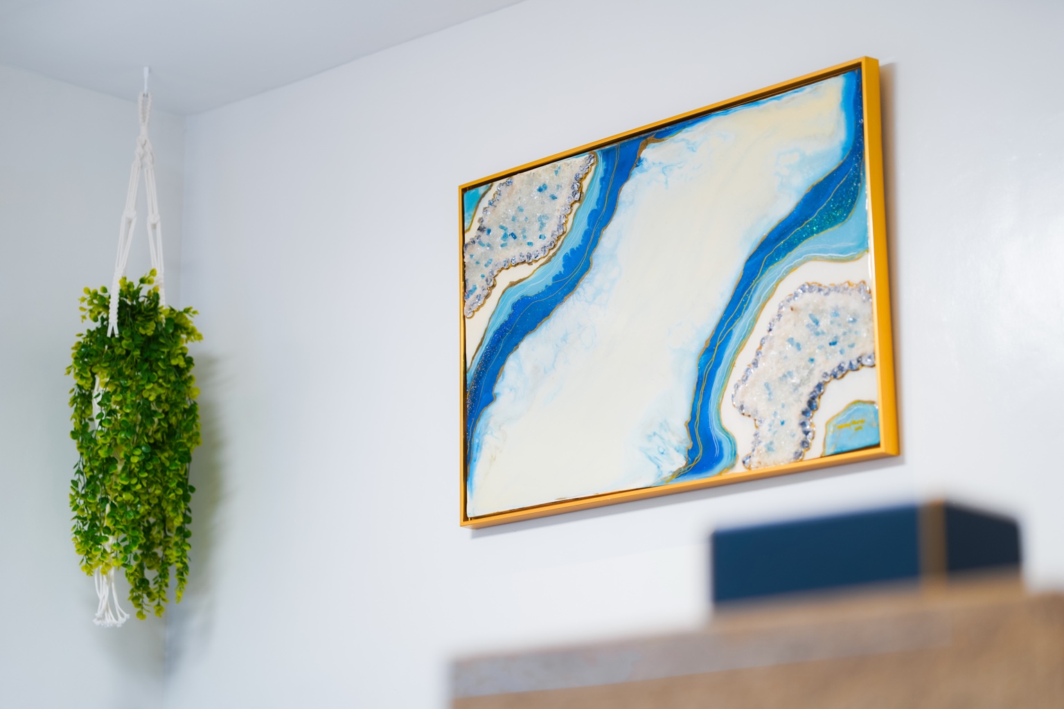 Blue, white and gold resin artwork inside Casa Lucia
